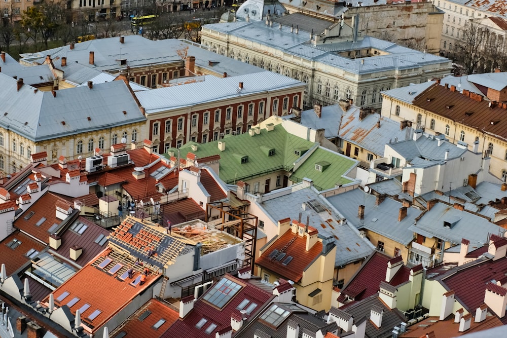 a view of a city from above with lots of roofs