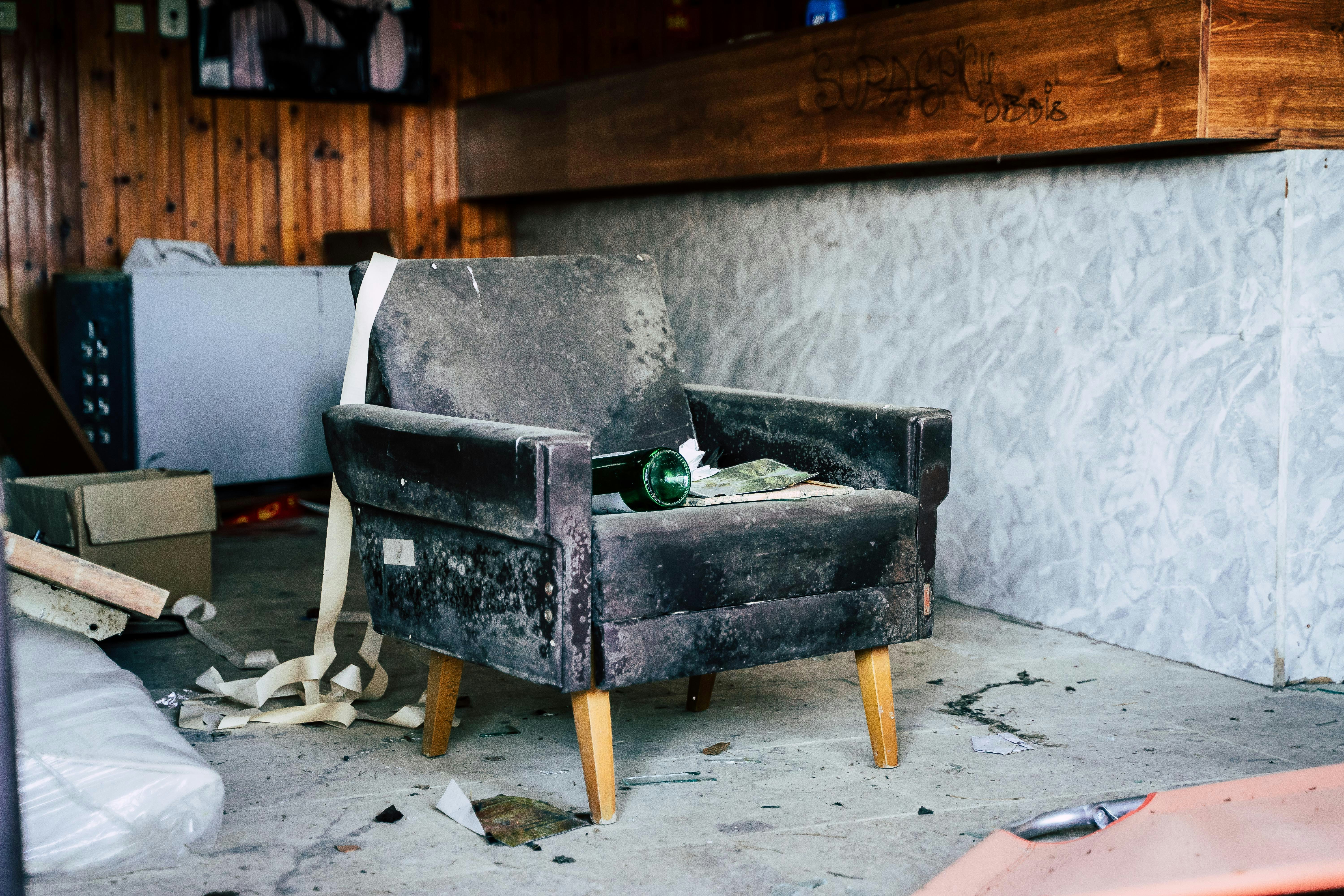 black wooden bench near white wall