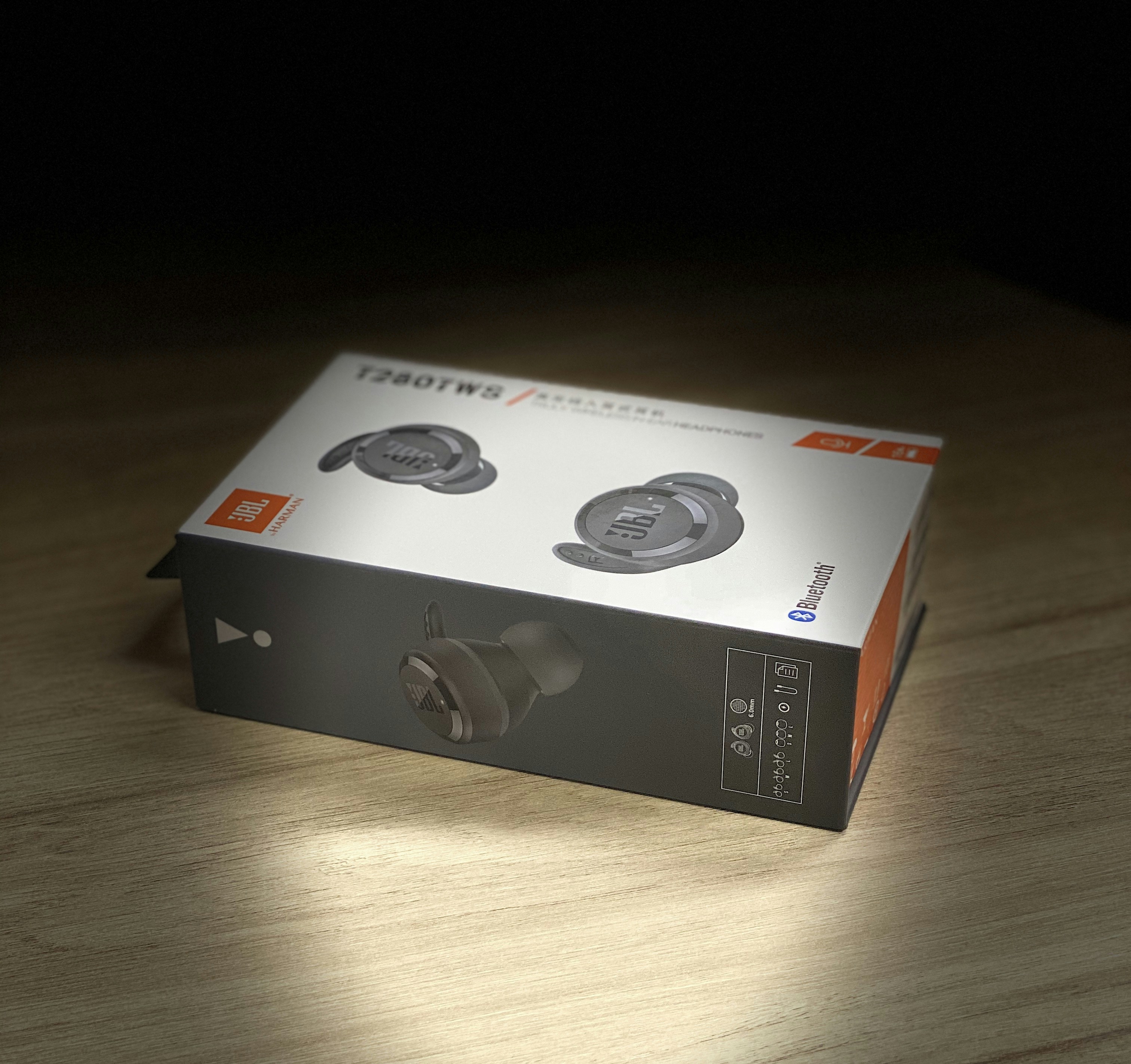 JBL wireless headphones in black, side angle product shot
