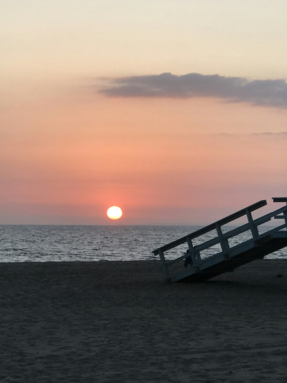 brown wooden dock on sea during sunset