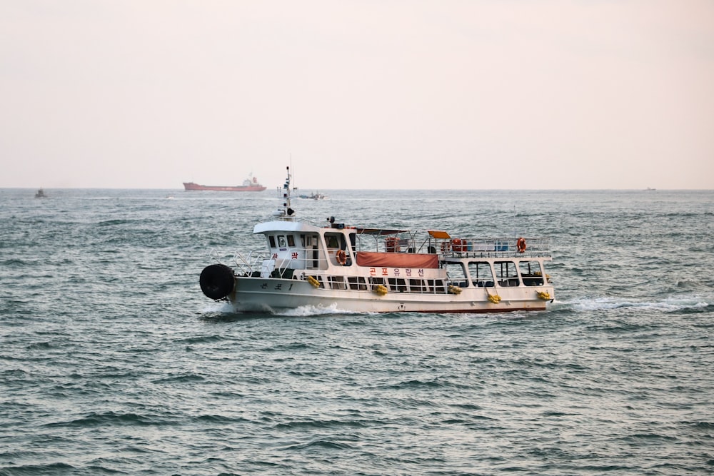 white and brown boat on sea during daytime