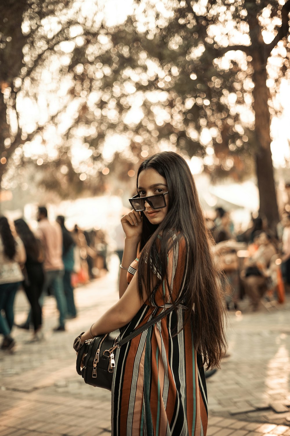 woman in black sunglasses and black tank top