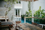 Outdoor seating area by the pool, ideal for relaxation.