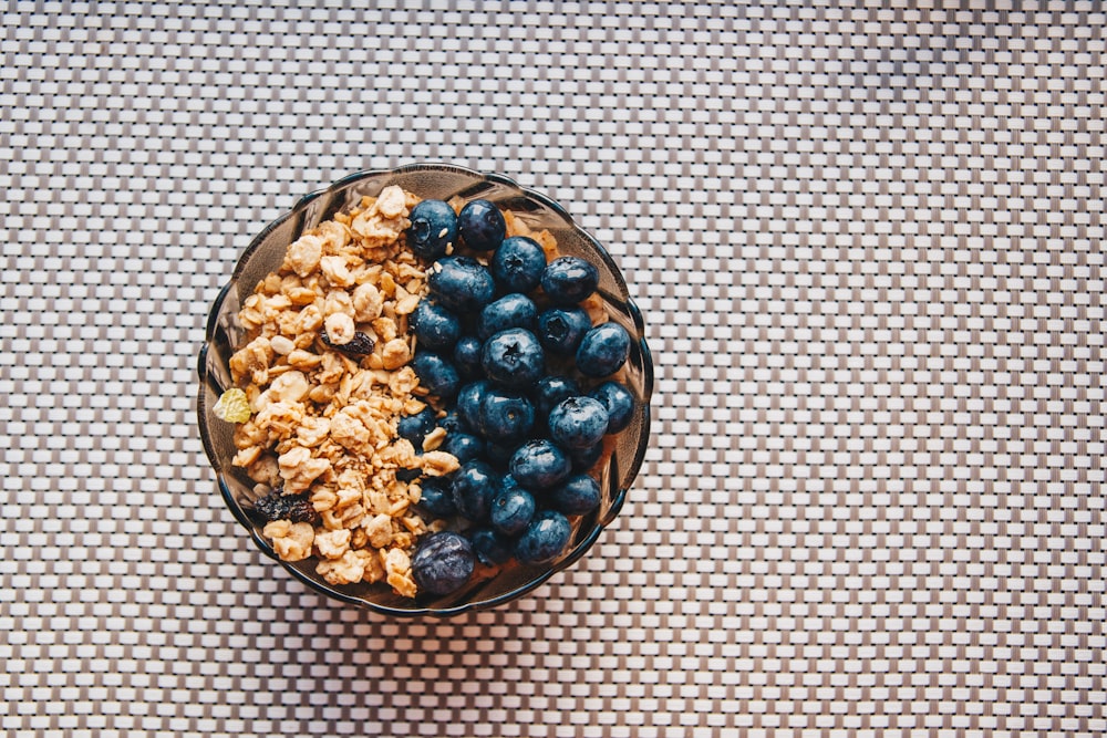 blue berries on brown ceramic bowl