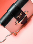 black and brown michael kors leather sling bag