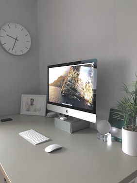 silver imac on white table