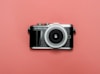 black and silver camera on red surface