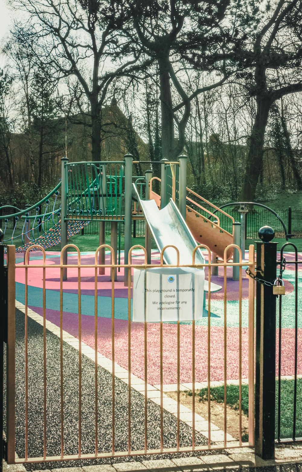 pink and white playground during daytime