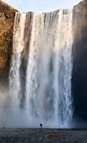 water falls on brown field