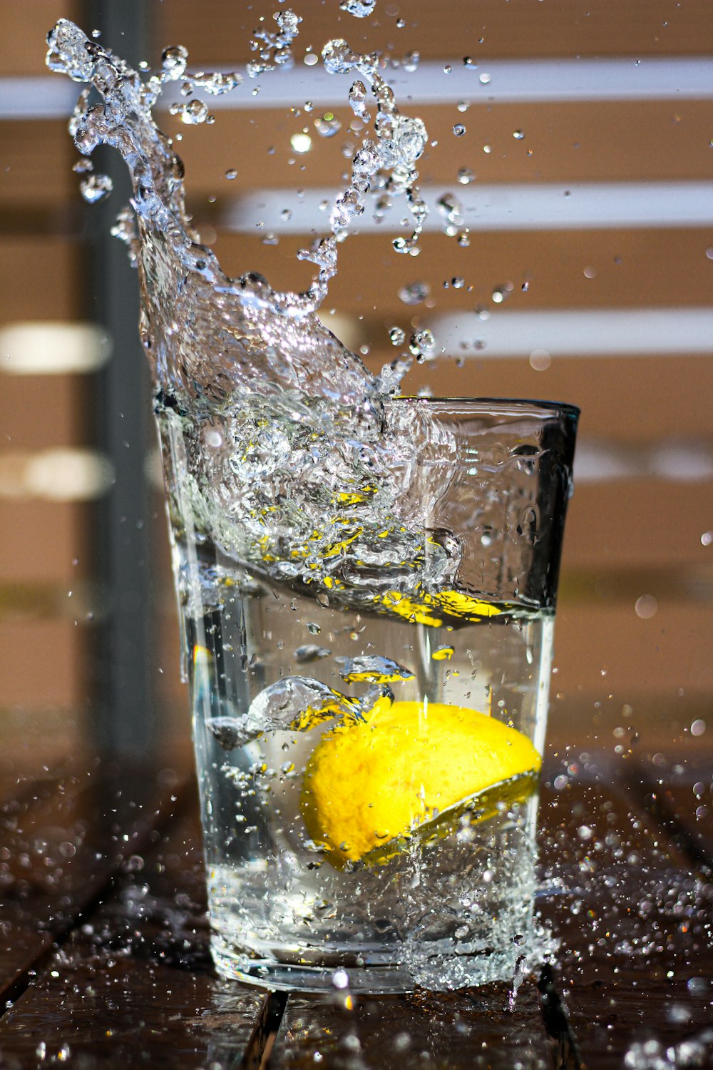 clear drinking glass with water and lemon