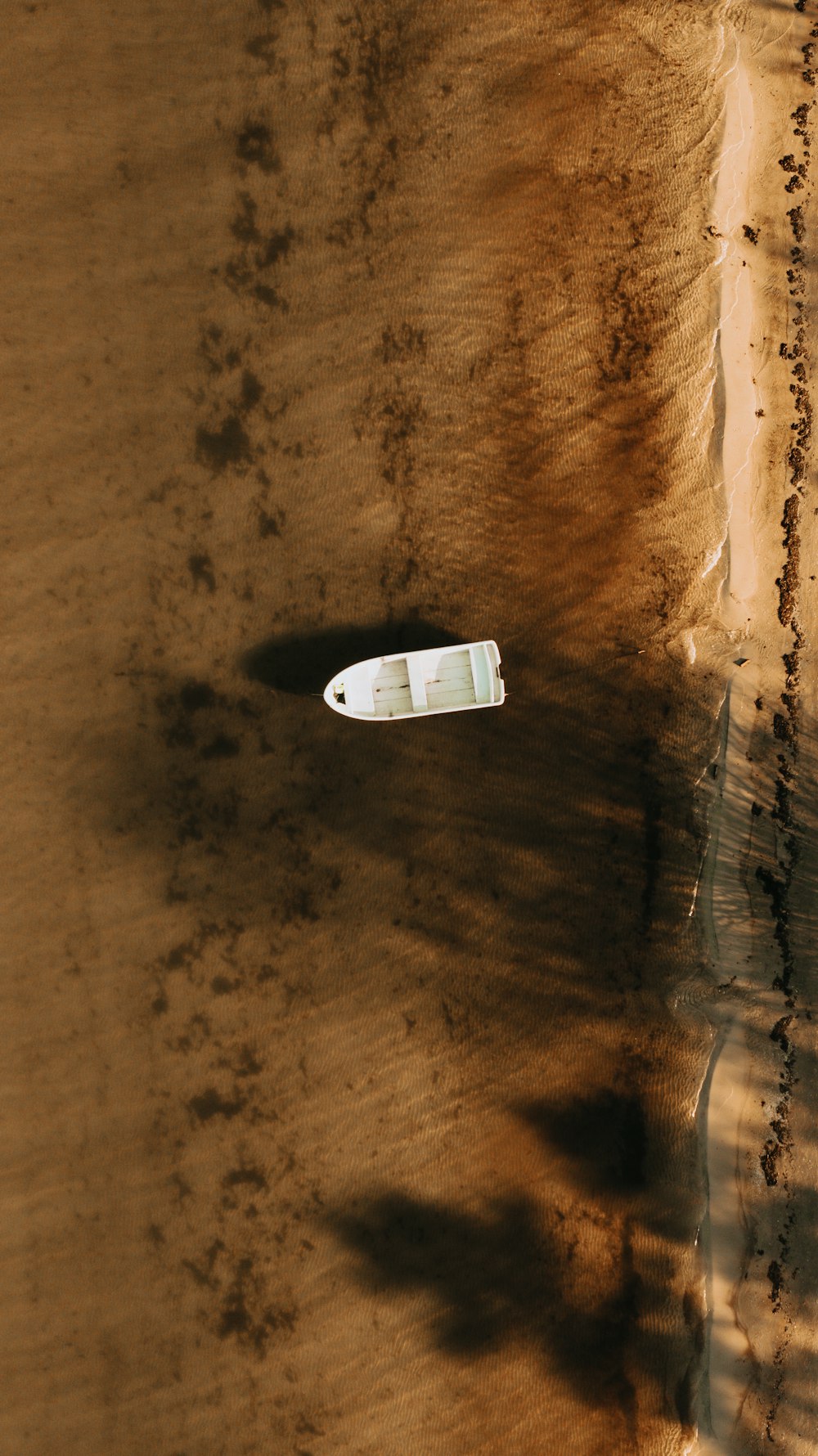 white airplane on brown sand