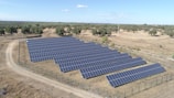 blue solar panel on gray concrete road during daytime