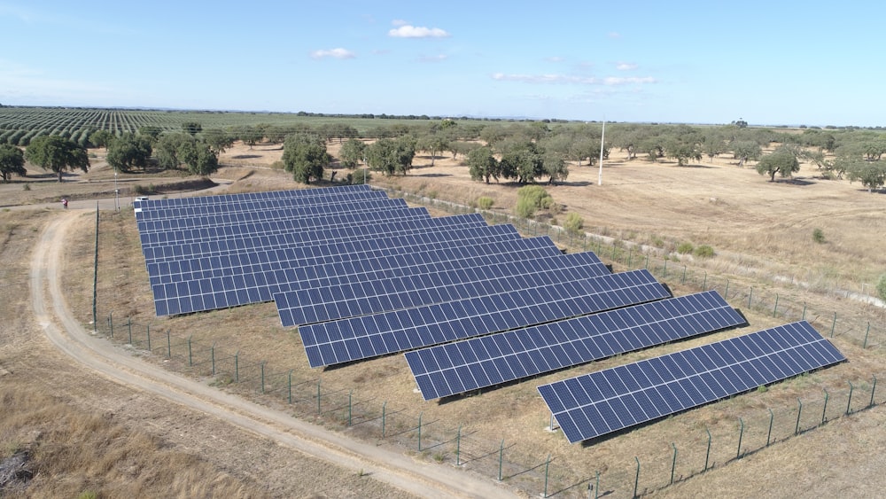 blue solar panel on gray concrete road during daytime