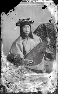 Portrait of Pandit Srinivas Bhatt in traditional attire, surrounded by astrological charts and sacred texts.