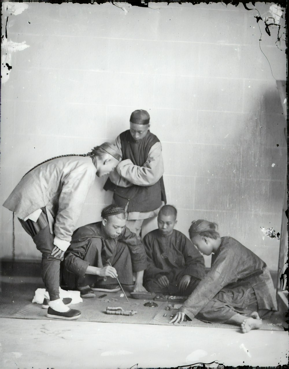 3 men sitting on floor