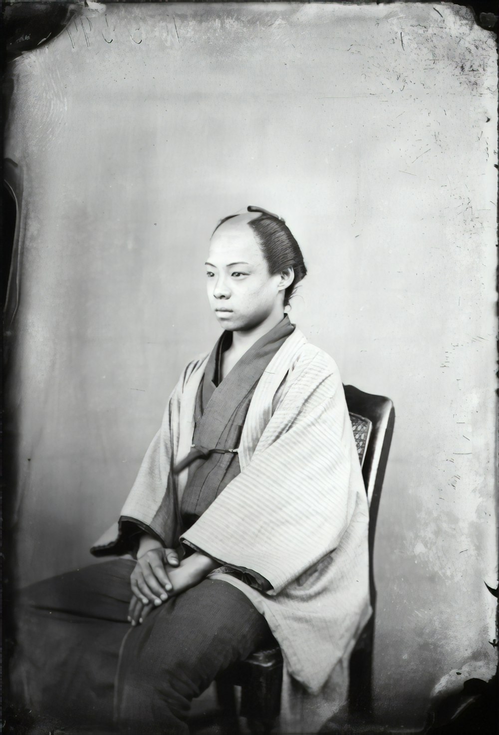 woman in white robe sitting on chair