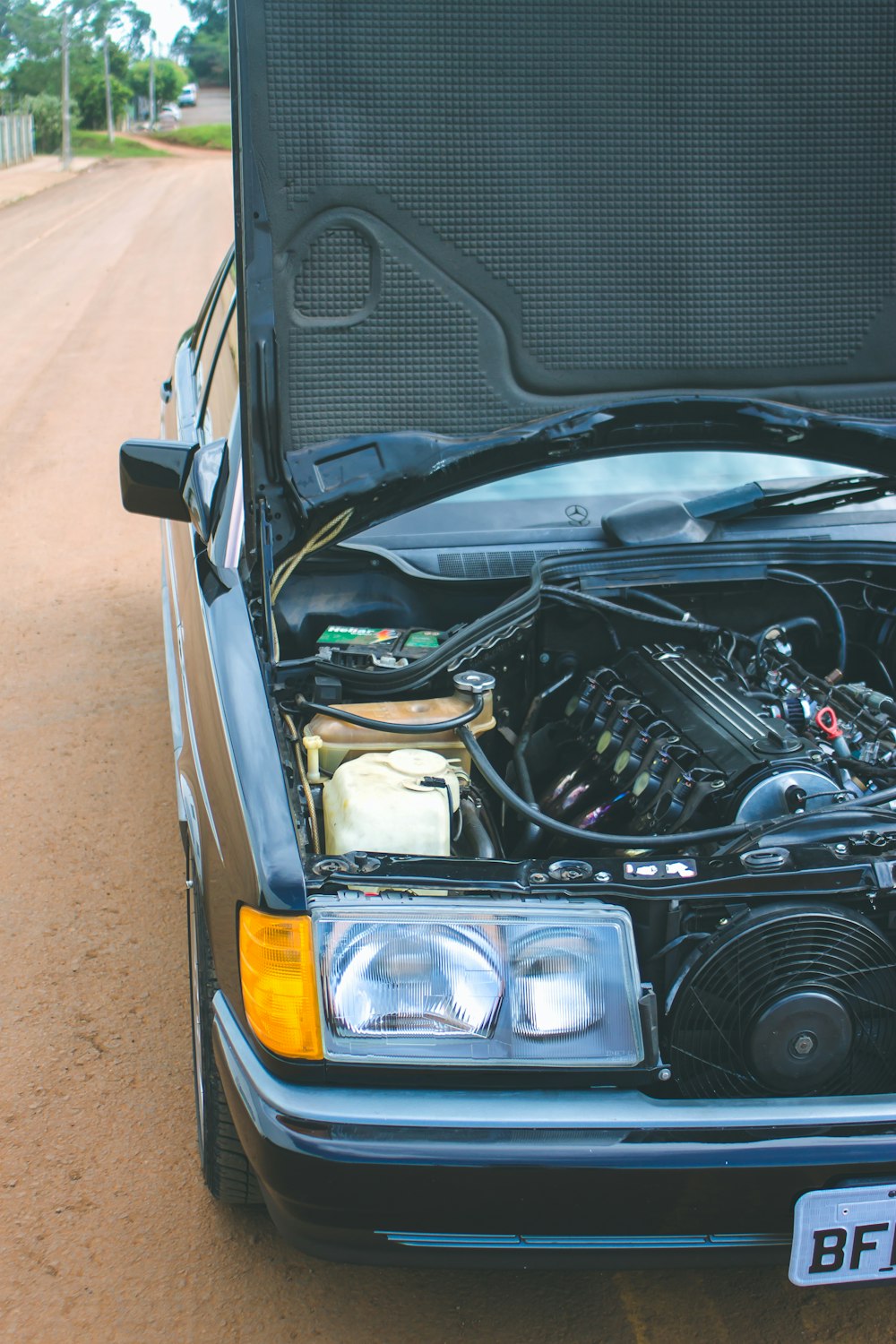 black and silver car engine bay