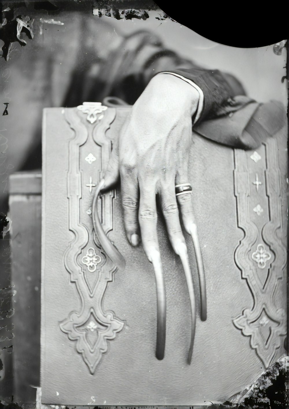 person holding a book with a heart carved