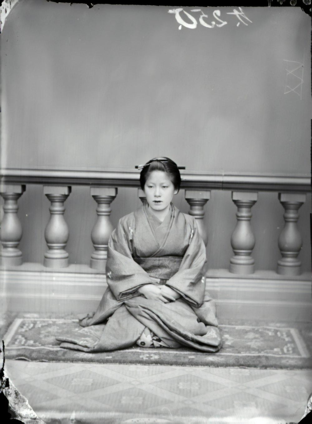 grayscale photo of girl sitting on floor