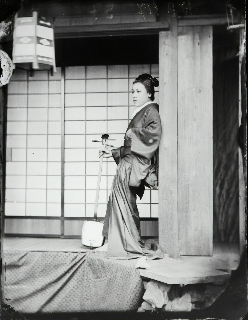 woman in white robe standing near white wall