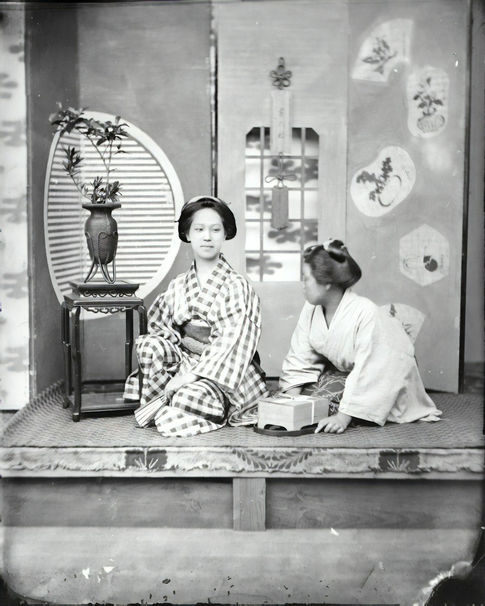 man in white robe sitting on brown wooden bench