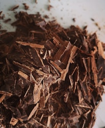 brown dried leaves on white surface