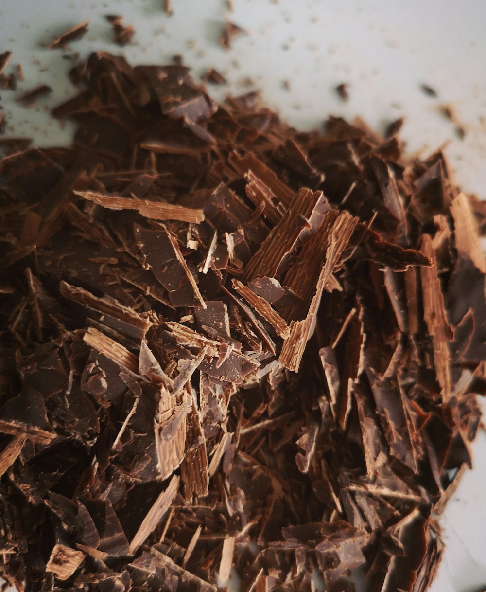 brown dried leaves on white surface