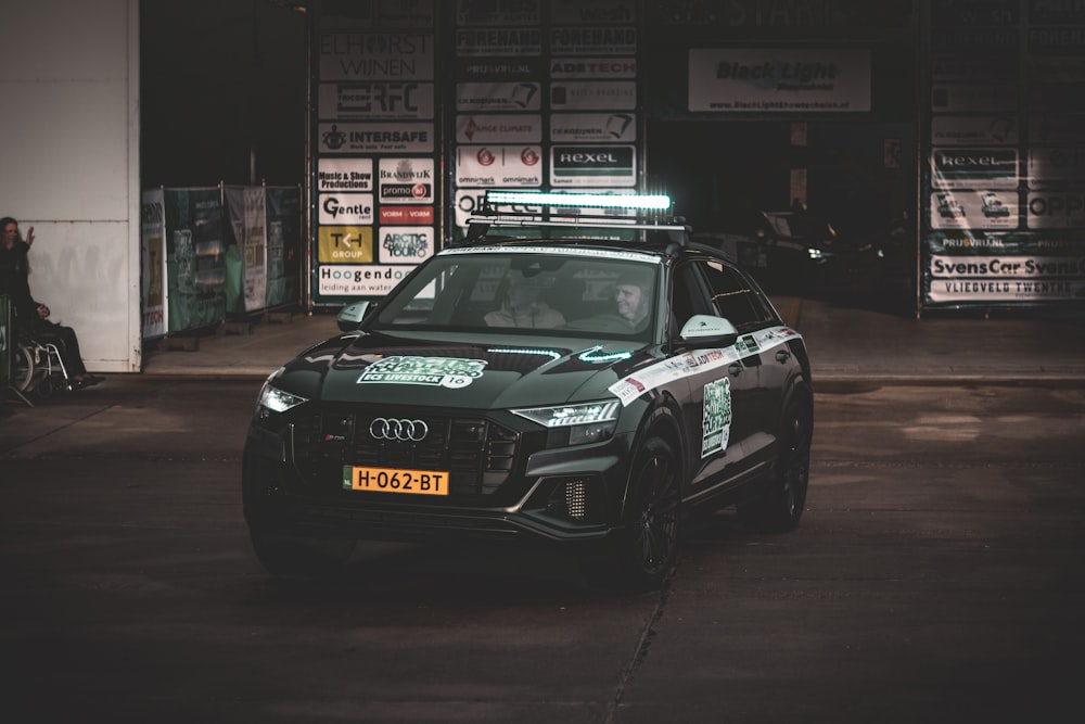 black audi r 8 parked on the street during night time