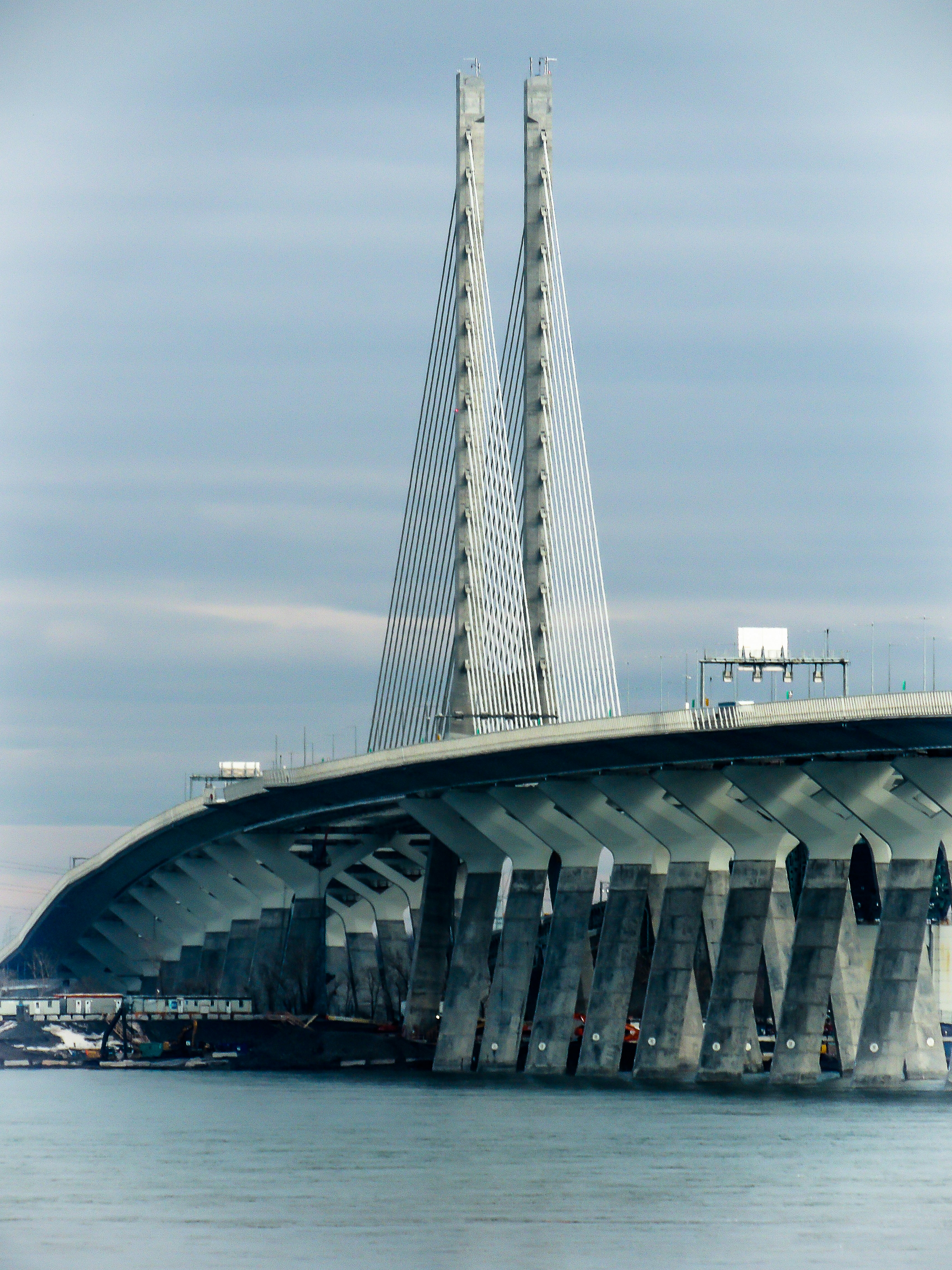 white bridge over body of water during daytime