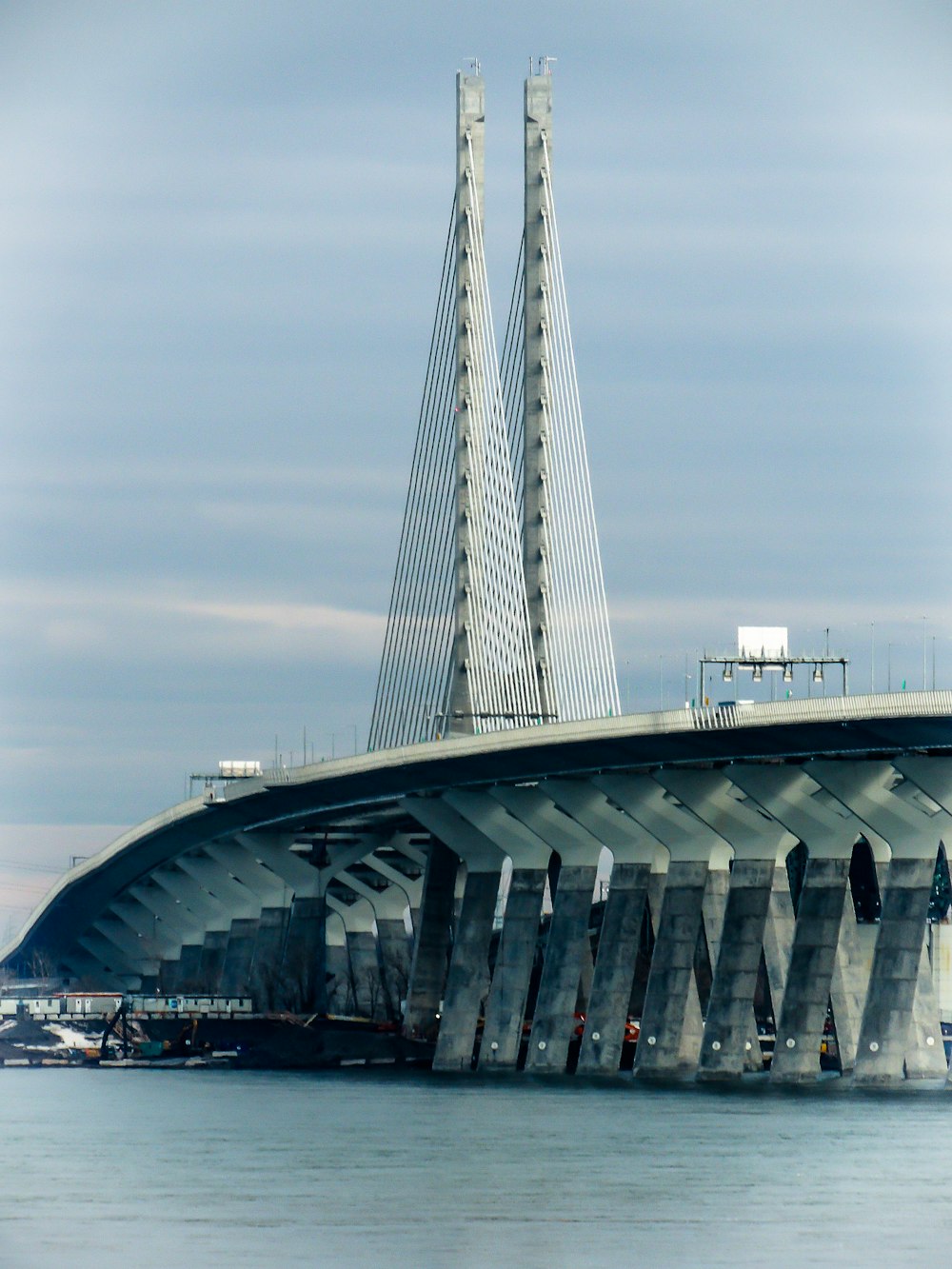 white bridge over body of water during daytime