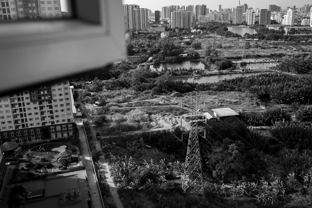 grayscale photo of city buildings