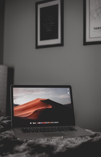 black laptop computer on white table