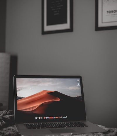 black laptop computer on white table