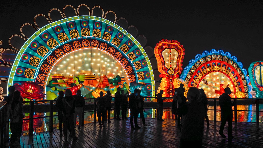 people standing near red and blue lights