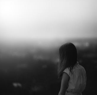 grayscale photo of woman in white shirt