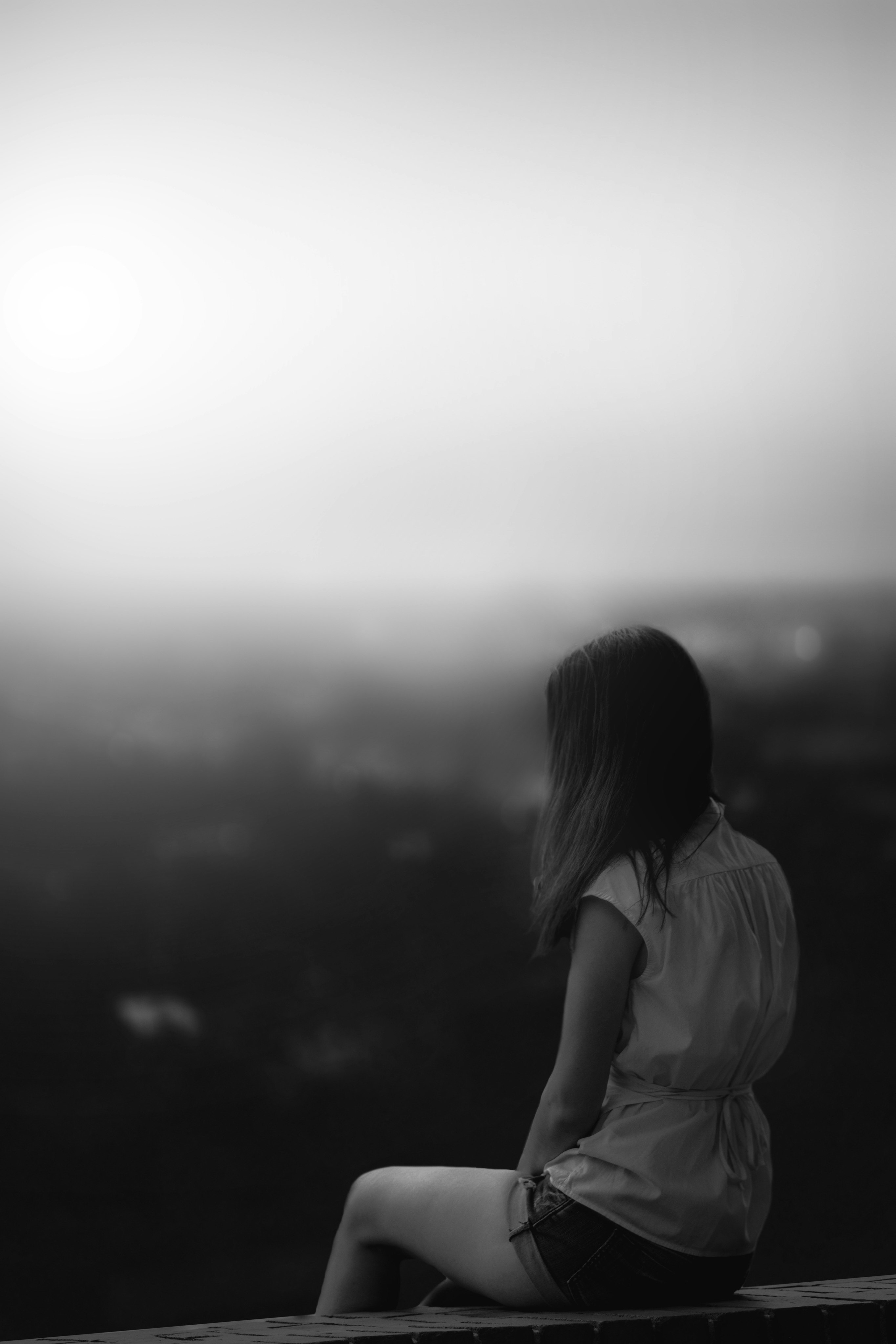 grayscale photo of woman in white shirt