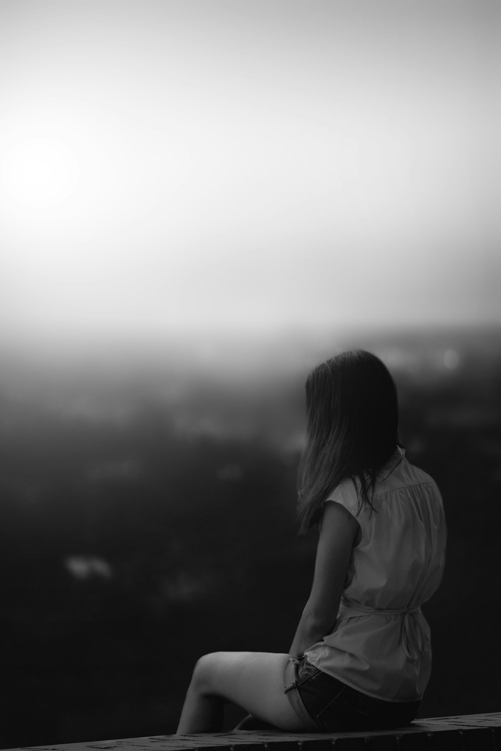 grayscale photo of woman in white shirt