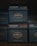Several stacked boxes of Steven Smith Teamaker tea, labeled with the blend 'Lord Bergamot' and 'Kandy'. The packaging is dark with orange and white text, highlighting blend numbers 55 and 23.