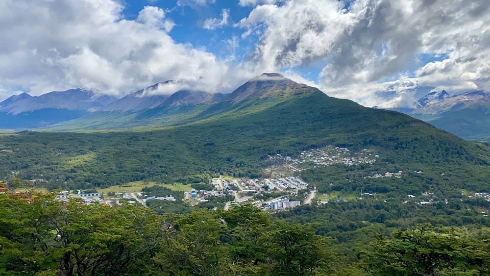 green mountain under white clouds during daytime