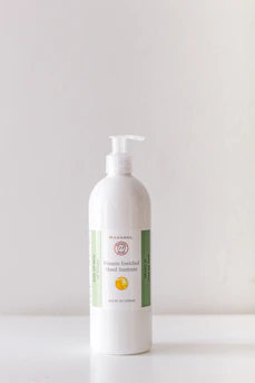 Colorful strawberry scented hand sanitizer bottle on a clean white background