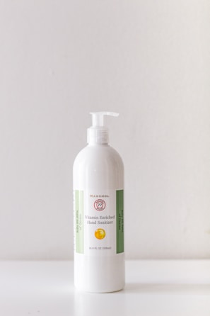 Close-up of Detro Enzym disinfectant bottle with hospital background