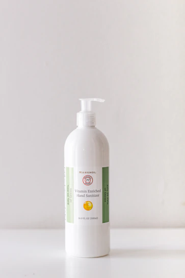 Colorful strawberry scented hand sanitizer bottle on a clean white background