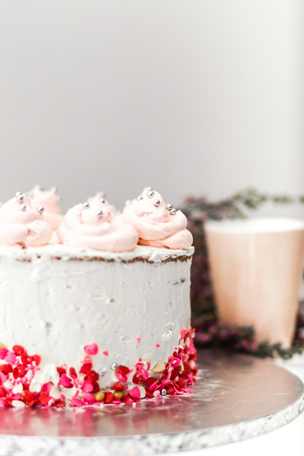 white icing covered cupcake with white icing on top