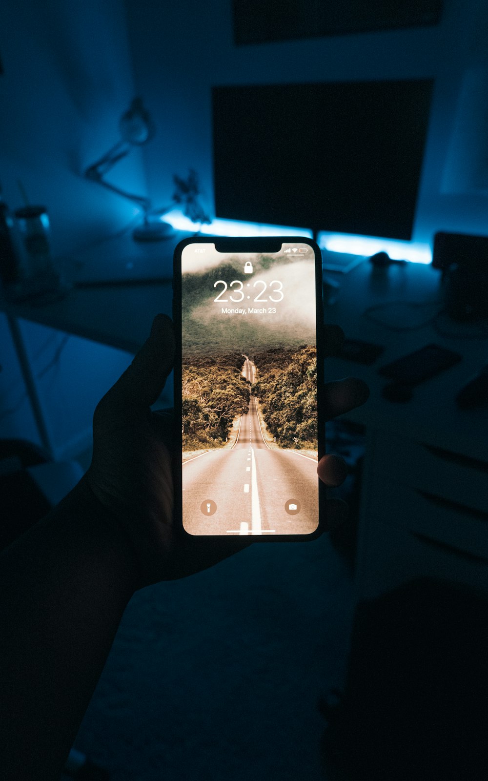 person holding iphone 6 with black case