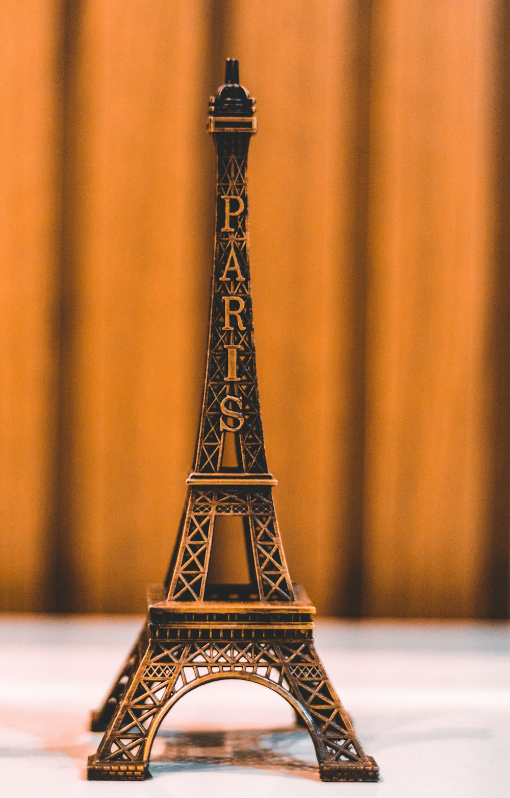eiffel tower scale model on white table