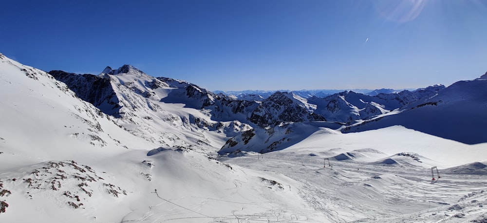 snow covered mountain under blue sky during daytime