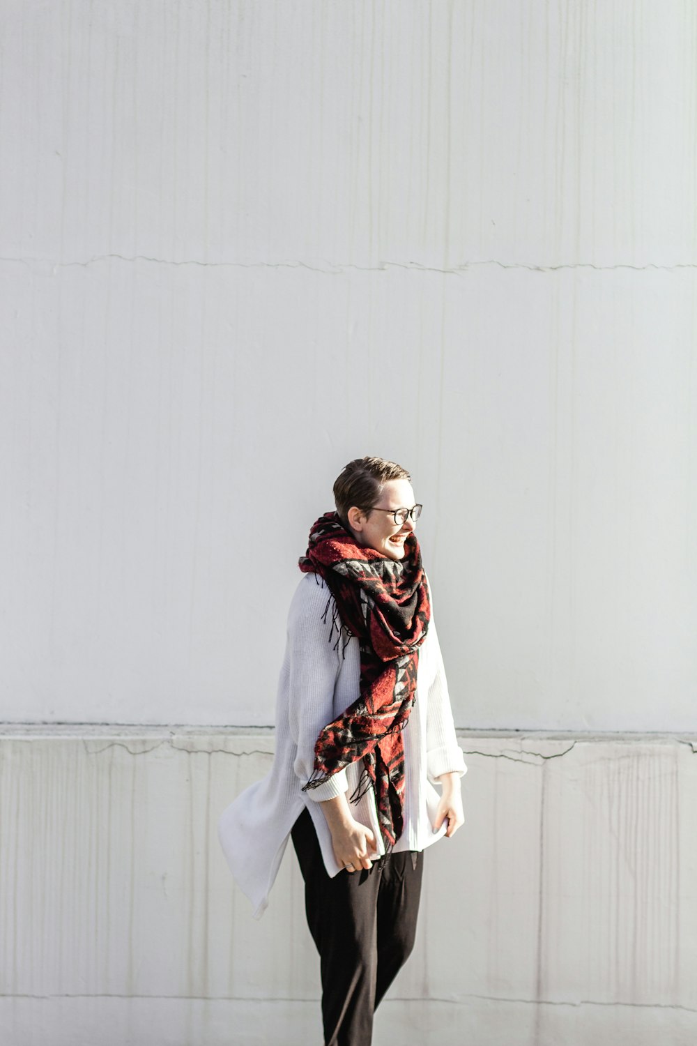 woman in white long sleeve dress and brown scarf