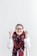 woman in white sweater wearing red scarf and black framed eyeglasses