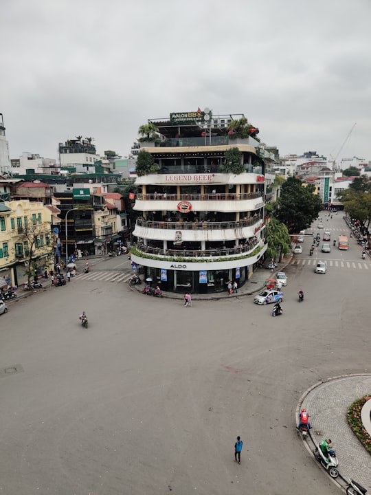 people walking on street during daytime in Hanoi Vietnam