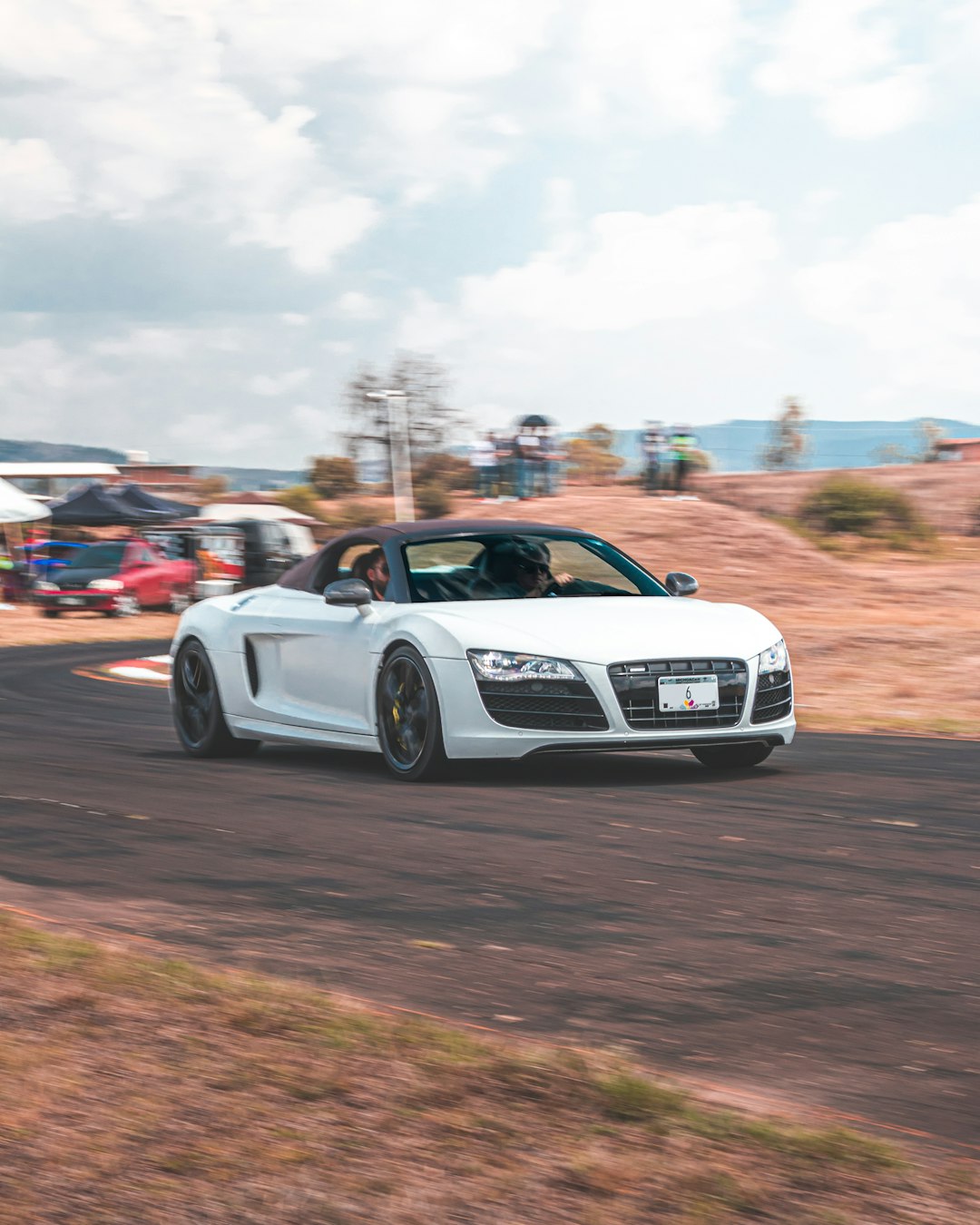 white audi r 8 on road during daytime